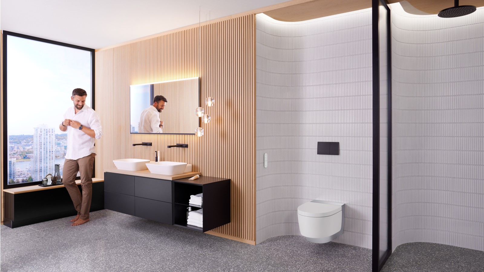 Mies Geberit ONE -kylpyhuoneessa, josta löytyy Geberit AquaClean Mera -pesu-wc-istuin ja Geberit Option Plus -peili Mies Geberit ONE -kylpyhuoneessa, josta löytyy Geberit AquaClean Mera -pesu-wc-istuin ja Geberit Option Plus -peili