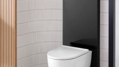 Kylpyhuone, jossa betonin värinen Geberit Monolith yhdessä Geberit iCon -wc-istuimen kanssa